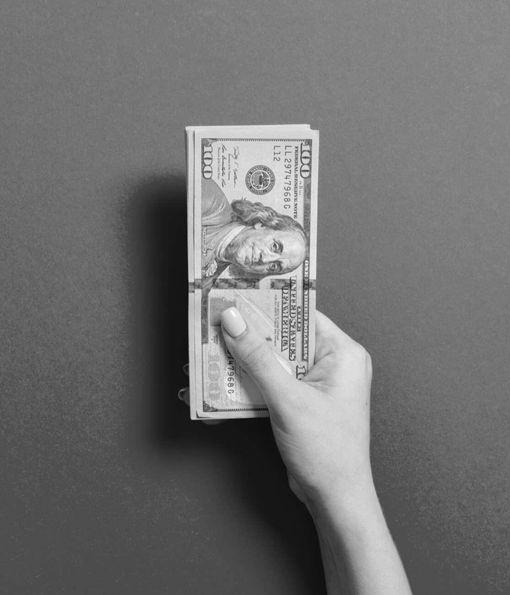 Hand holding money